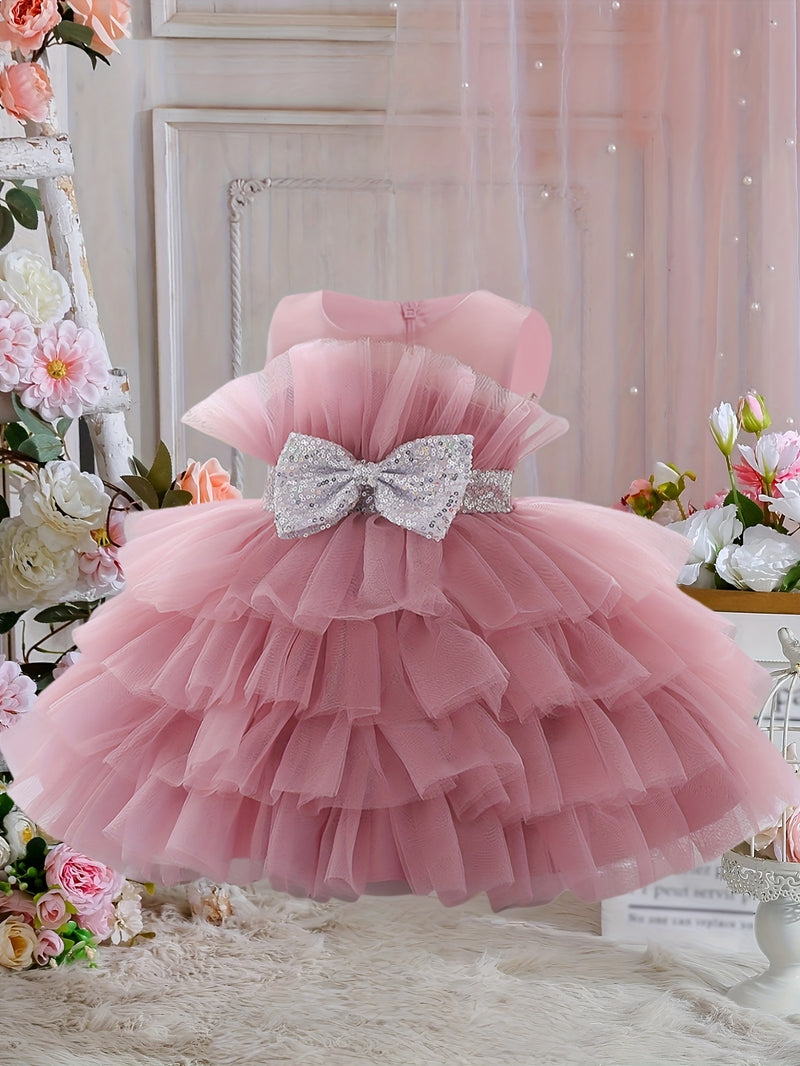 The Girl's Ethereal Puffy Dress, Perfect for a Baby's Birthday Party.