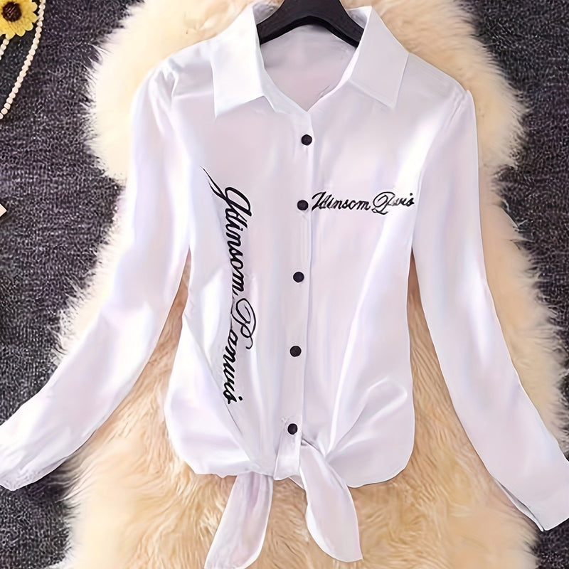 The Lady's Shirt Is White with Black Letters.