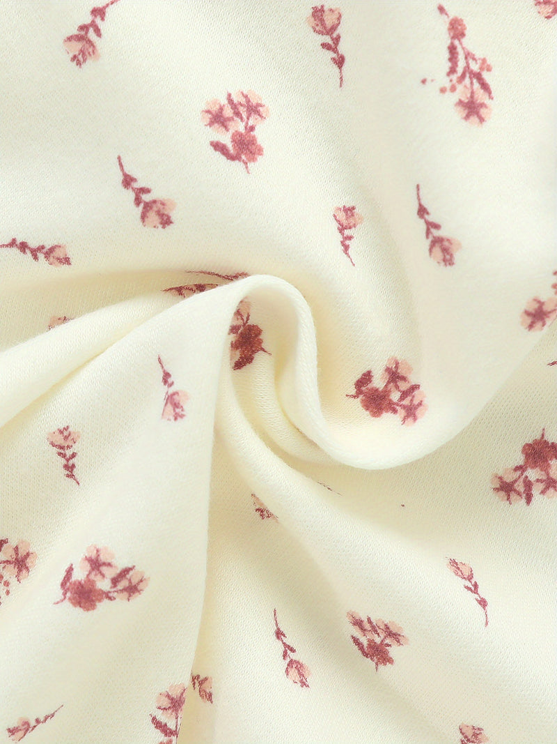 Four-Piece Infant Romper, Long-Sleeve Top, and Footed Pants Set.