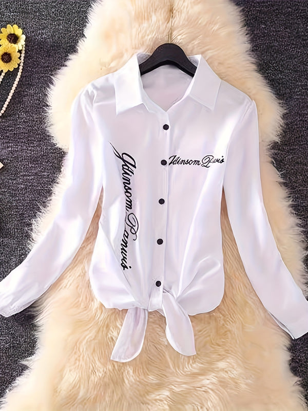 The Lady's Shirt Is White with Black Letters.