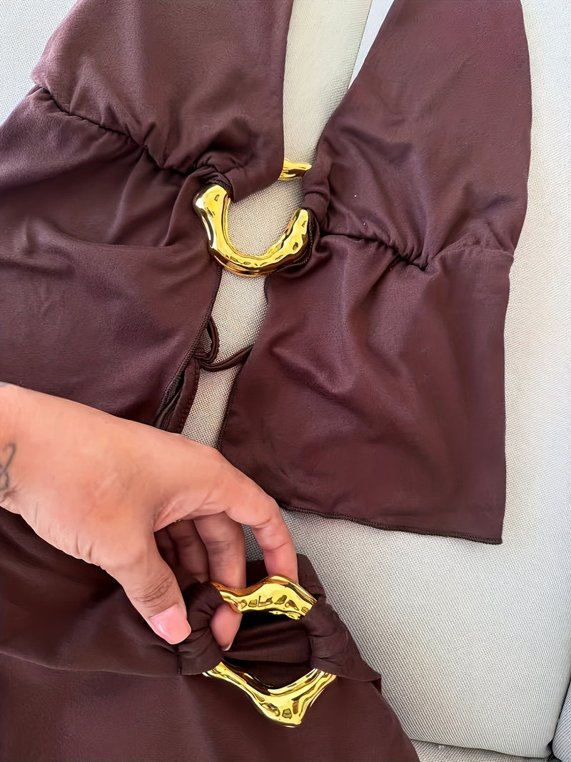 Women’s Featuring a Backless Halter Neck Top with a Unique Metallic Buckle.