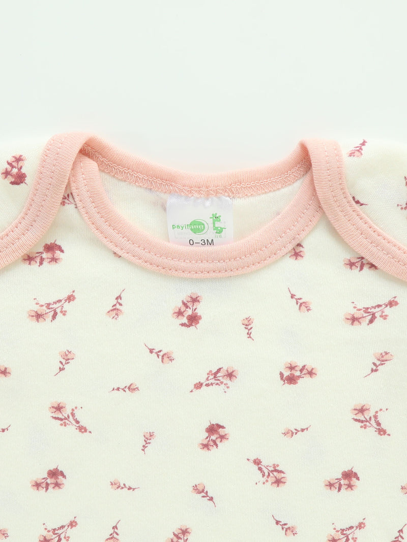 Four-Piece Infant Romper, Long-Sleeve Top, and Footed Pants Set.