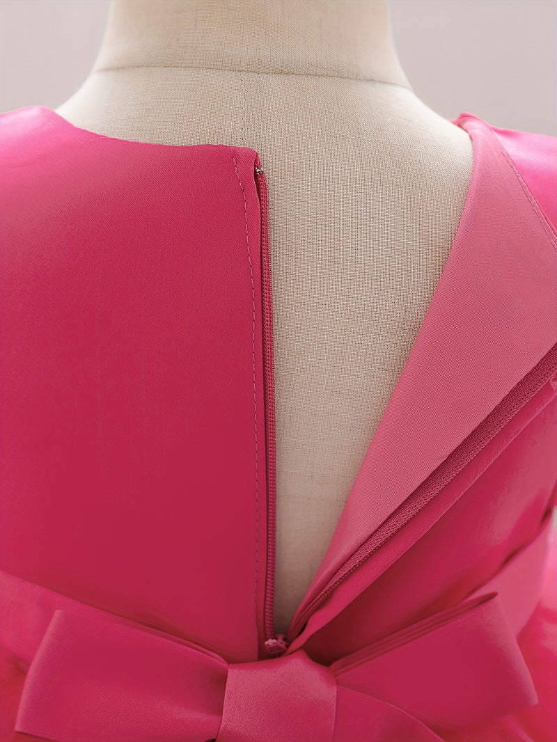 The Girl's Ethereal Puffy Dress, Perfect for a Baby's Birthday Party.
