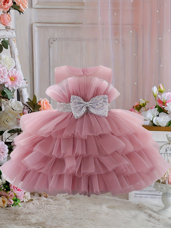 The Girl's Ethereal Puffy Dress, Perfect for a Baby's Birthday Party.