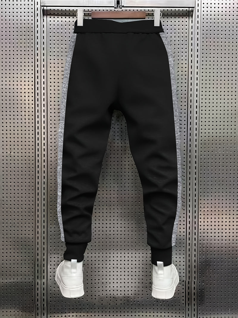 Men's Color Blocked Drawstring Sports Pants with Eye-catching Print Design.