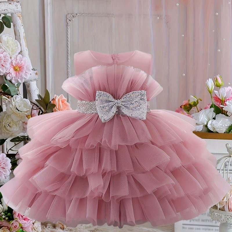 The Girl's Ethereal Puffy Dress, Perfect for a Baby's Birthday Party.
