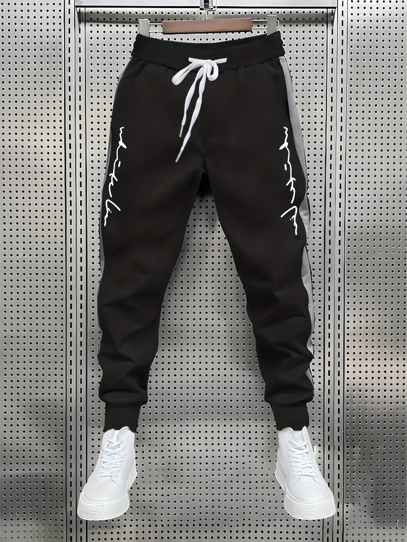 Men's Color Blocked Drawstring Sports Pants with Eye-catching Print Design.