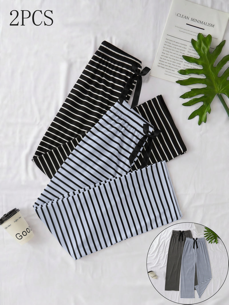 Women's Two-Piece Set Featuring a Classic Black And White Striped Theme.