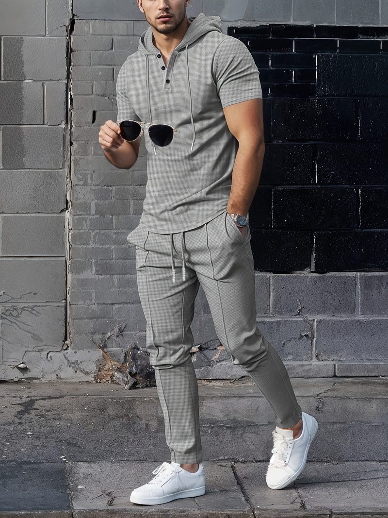 Men's set short sleeved hooded top with drawstring elastic waistband.