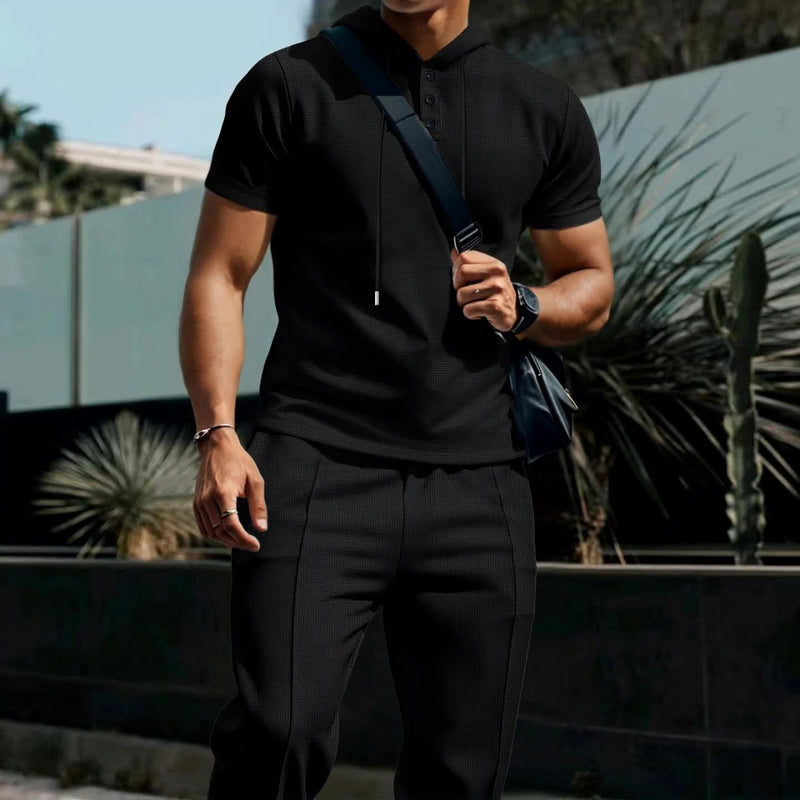 Men's set short sleeved hooded top with drawstring elastic waistband.