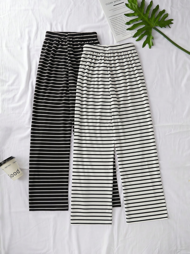 Elegant Women'S Two-Piece Set Featuring a Classic Black And White.