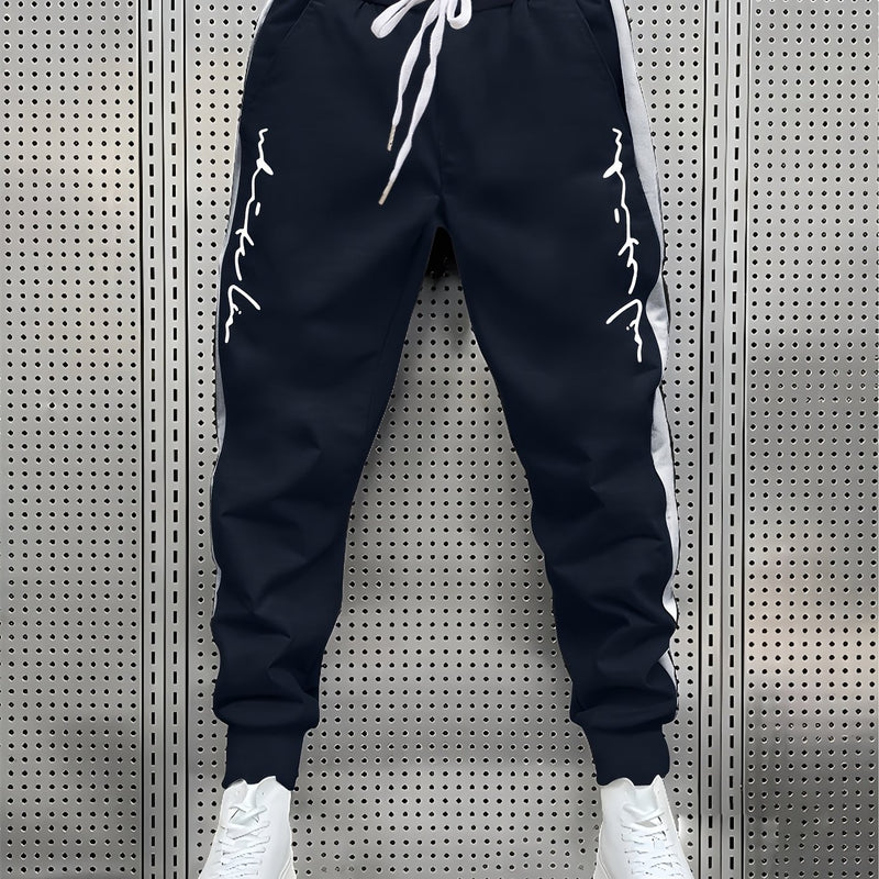 Men's Color Blocked Drawstring Sports Pants with Eye-catching Print Design.