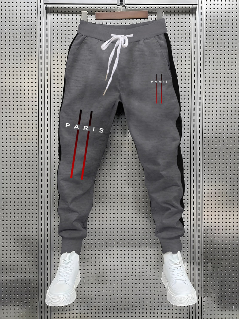 Stylish Men's Color-Blocked Jogger Pants Featuring a Striking Print Design.