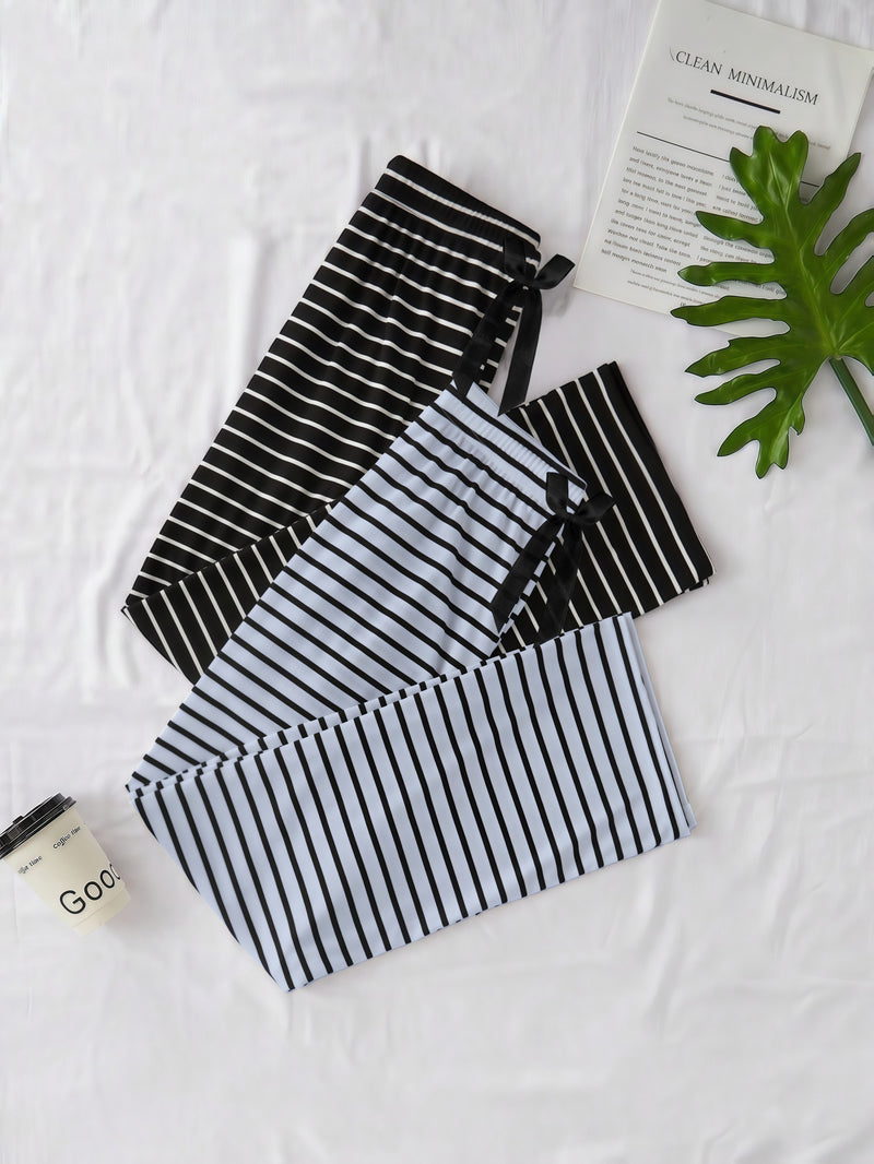 Elegant Women'S Two-Piece Set Featuring a Classic Black And White.