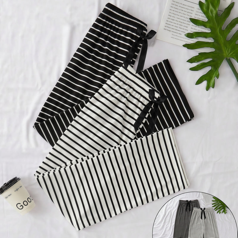 Elegant Women'S Two-Piece Set Featuring a Classic Black And White.