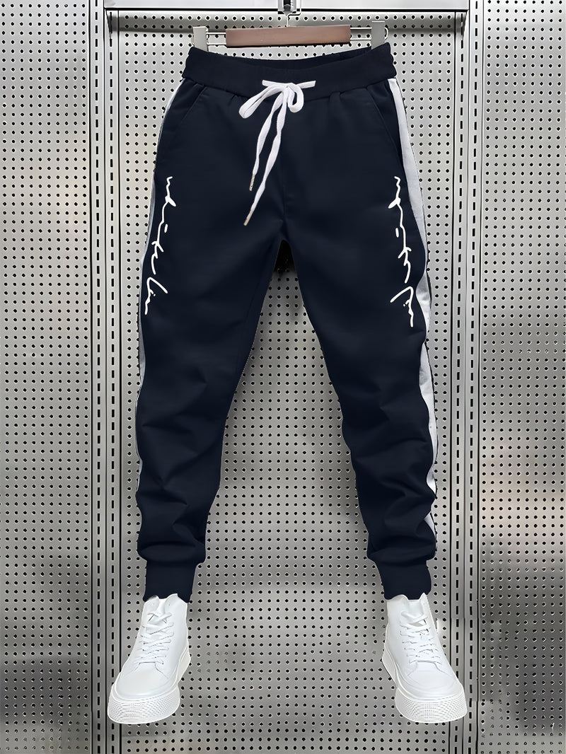 Men's Color Blocked Drawstring Sports Pants with Eye-catching Print Design.