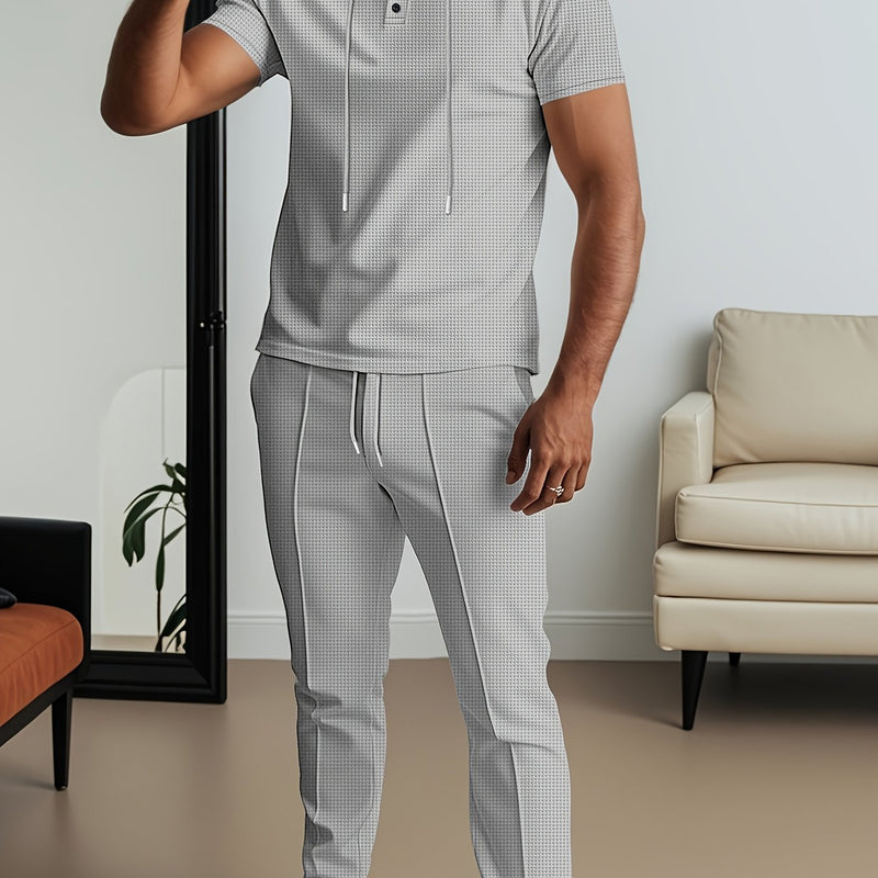 Men's set short sleeved hooded top with drawstring elastic waistband.