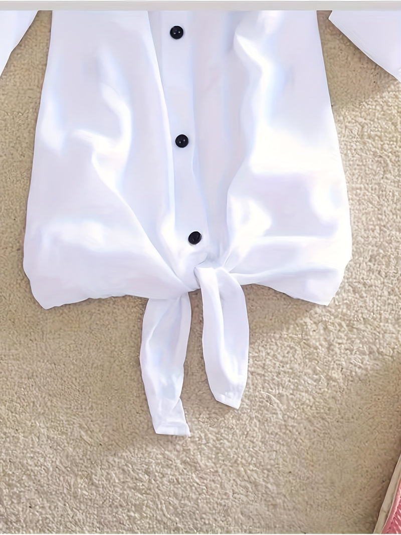 The Lady's Shirt Is White with Black Letters.