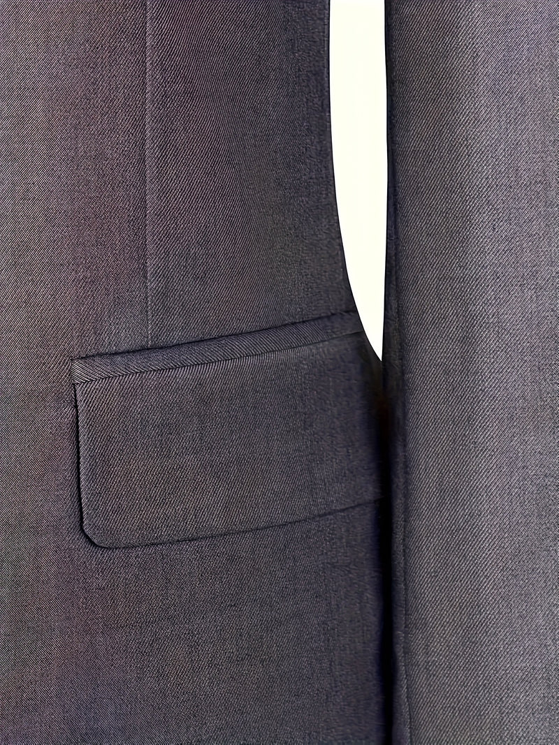 A Men's Three-Piece Suit Consisting of a Blazer, Vest, And Trousers.