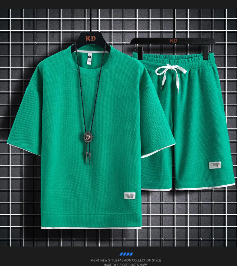 Men's short sleeved T-shirt and sports shorts set casual sportswear.