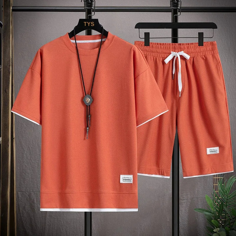 Men's short sleeved T-shirt and sports shorts set casual sportswear.