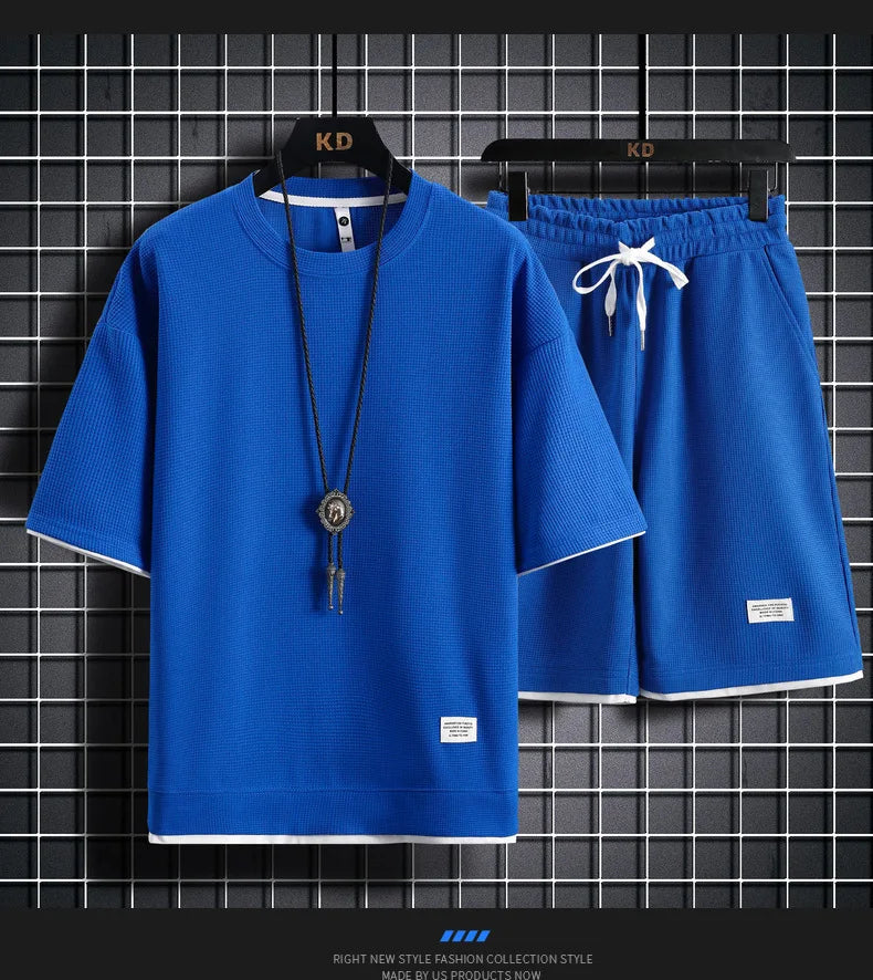 Men's short sleeved T-shirt and sports shorts set casual sportswear.