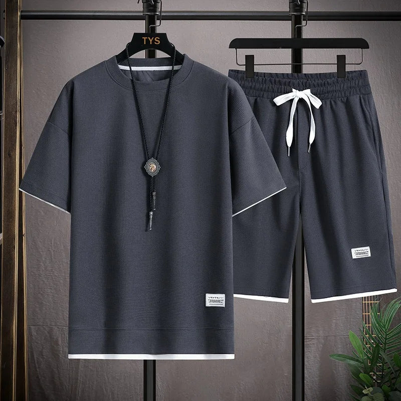 Men's short sleeved T-shirt and sports shorts set casual sportswear.