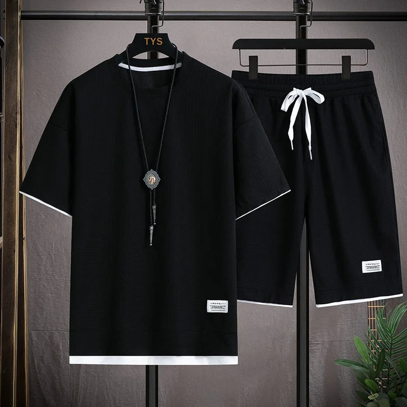 Men's short sleeved T-shirt and sports shorts set casual sportswear.