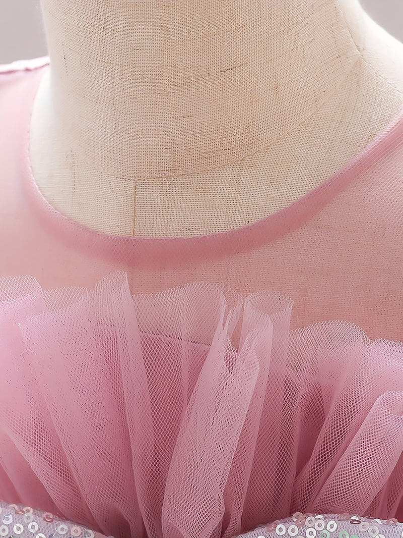 The Girl's Ethereal Puffy Dress, Perfect for a Baby's Birthday Party.