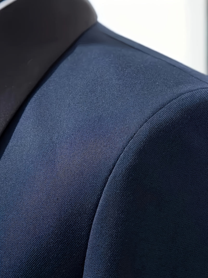 A Men's Three-Piece Suit Consisting of a Blazer, Vest, And Trousers.