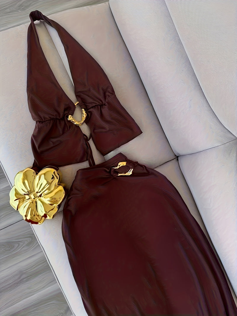 Women’s Featuring a Backless Halter Neck Top with a Unique Metallic Buckle.