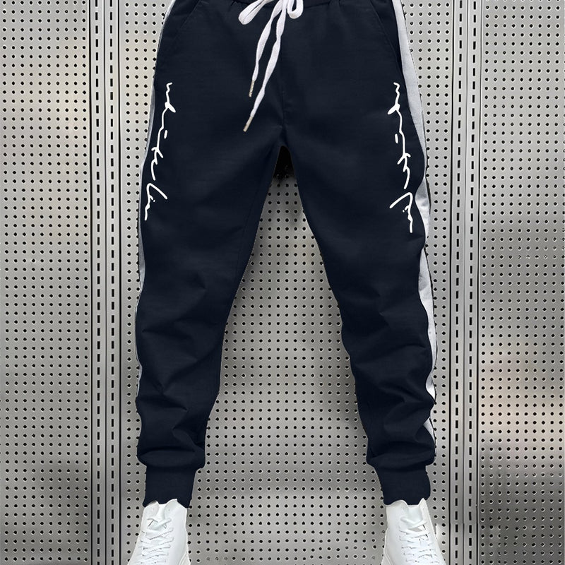 Men's Color Blocked Drawstring Sports Pants with Eye-catching Print Design.