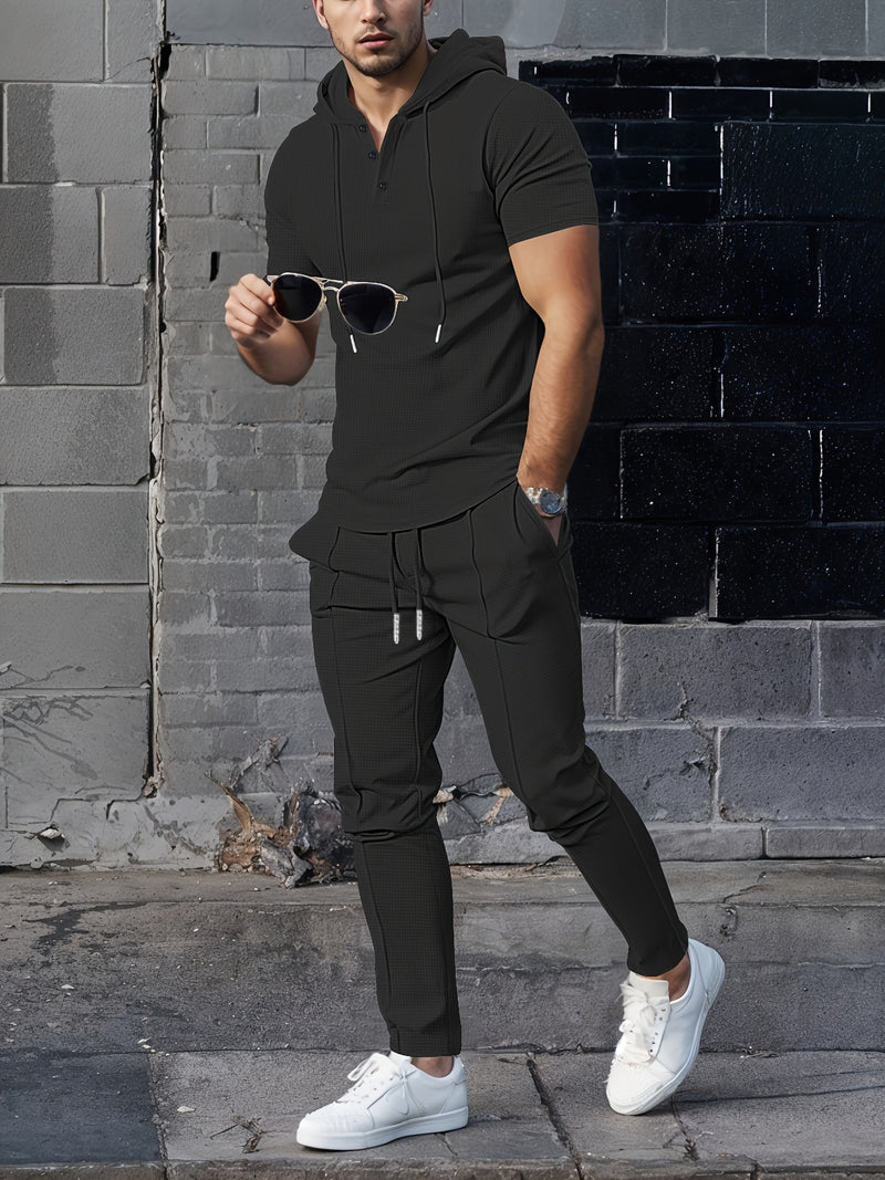 Men's set short sleeved hooded top with drawstring elastic waistband.