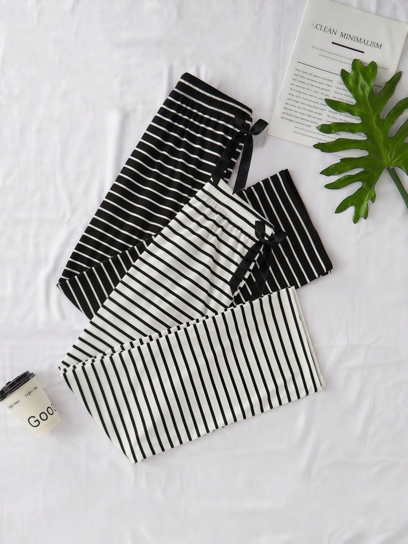 Women's Two-Piece Set Featuring a Classic Black And White Striped Theme.