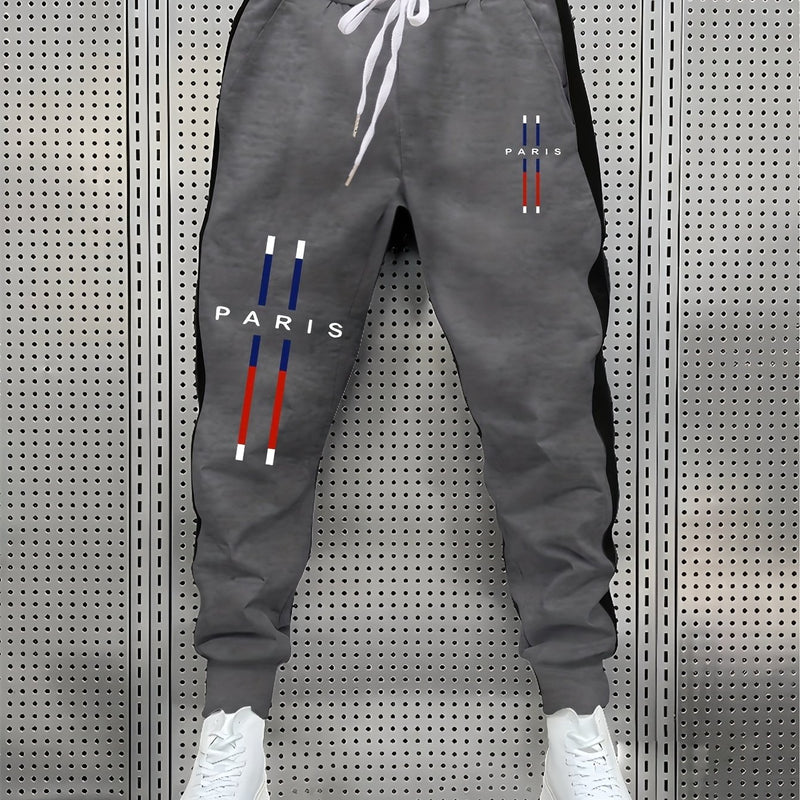 fashionable Men's color blocked drawstring sports pants.