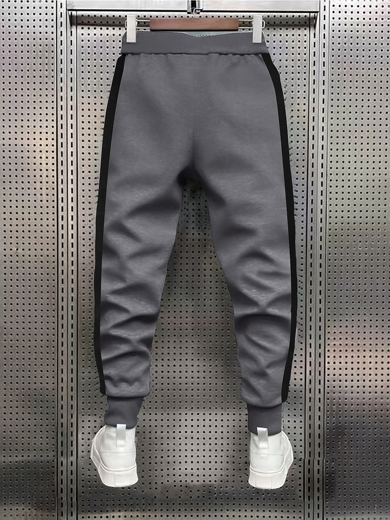 fashionable Men's color blocked drawstring sports pants.