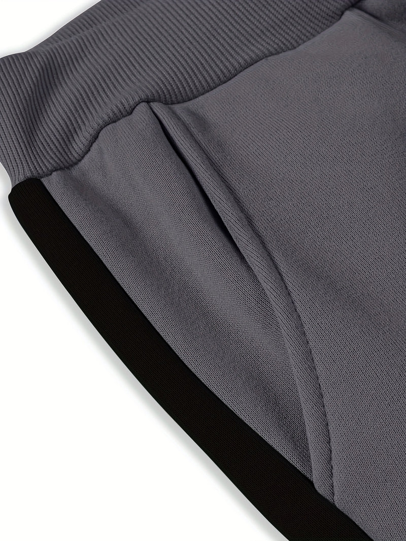 Men's Color Blocked Drawstring Sports Pants with Eye-catching Print Design.