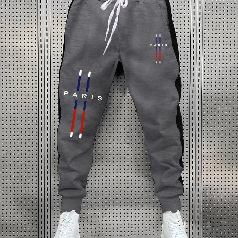 fashionable Men's color blocked drawstring sports pants.