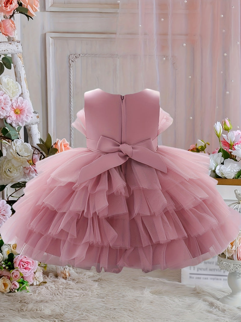 The Girl's Ethereal Puffy Dress, Perfect for a Baby's Birthday Party.